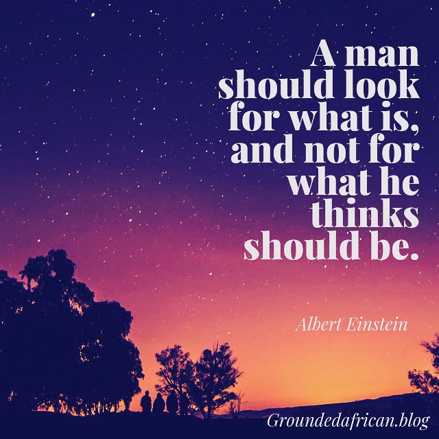 A dawn sky with stars and quote by Albert Einstein 