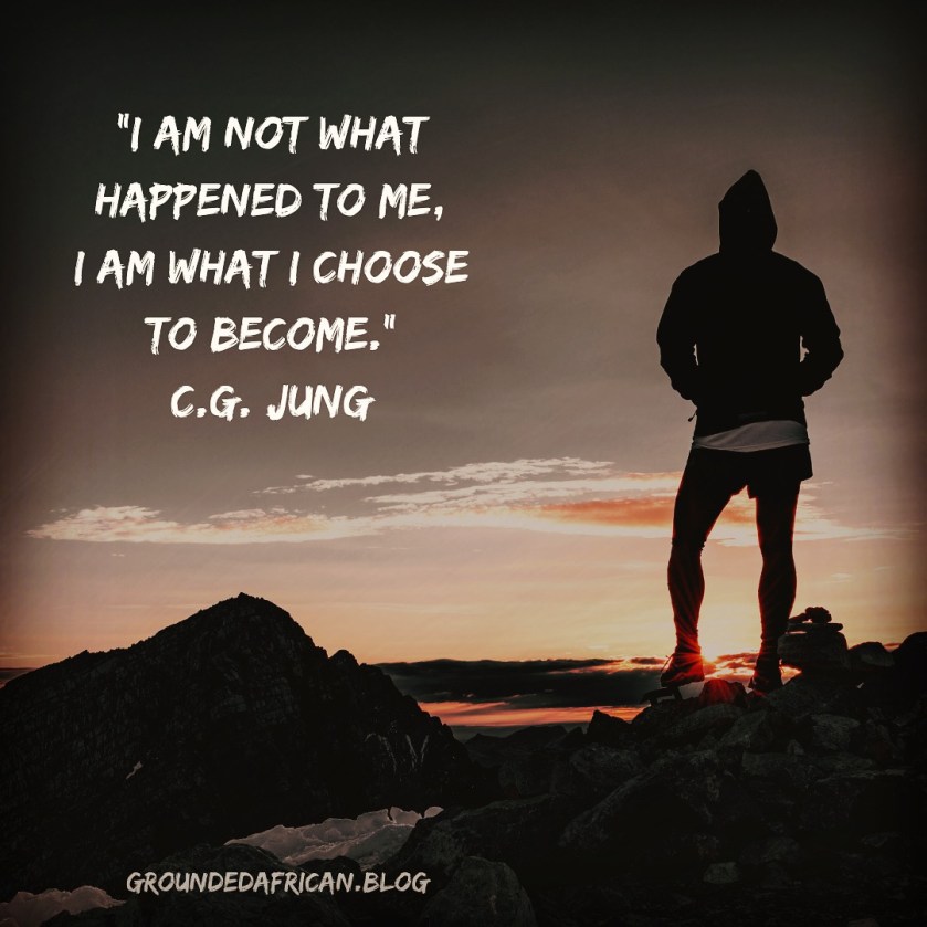 Man on mountain at sunrise in running or hiking gear. Quote by C.G. Jung