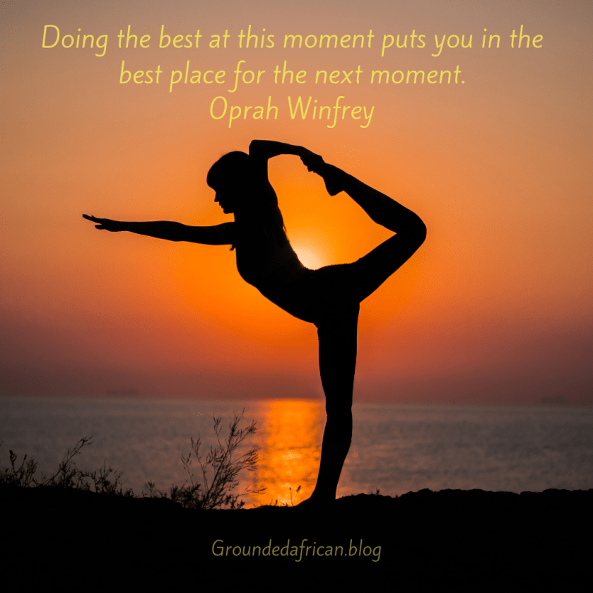 Woman doing yoga pose with the rising sun as a backdrop. Quote by Oprah Winfrey