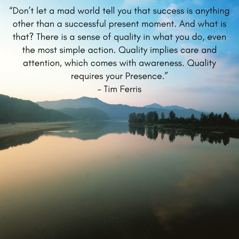 Lake surrounded by forest at dusk. Quote by Tim Ferris 