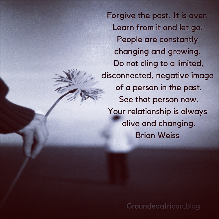 Woman holding flower behind man. Quote by Brian Weiss