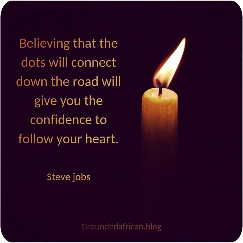 Candle burning against black background. Quote by Steve Jobs