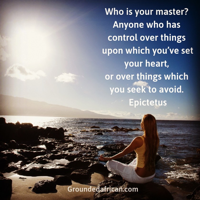 Woman meditating on rocky beach facing the rising sun. Quote by Epictetus 