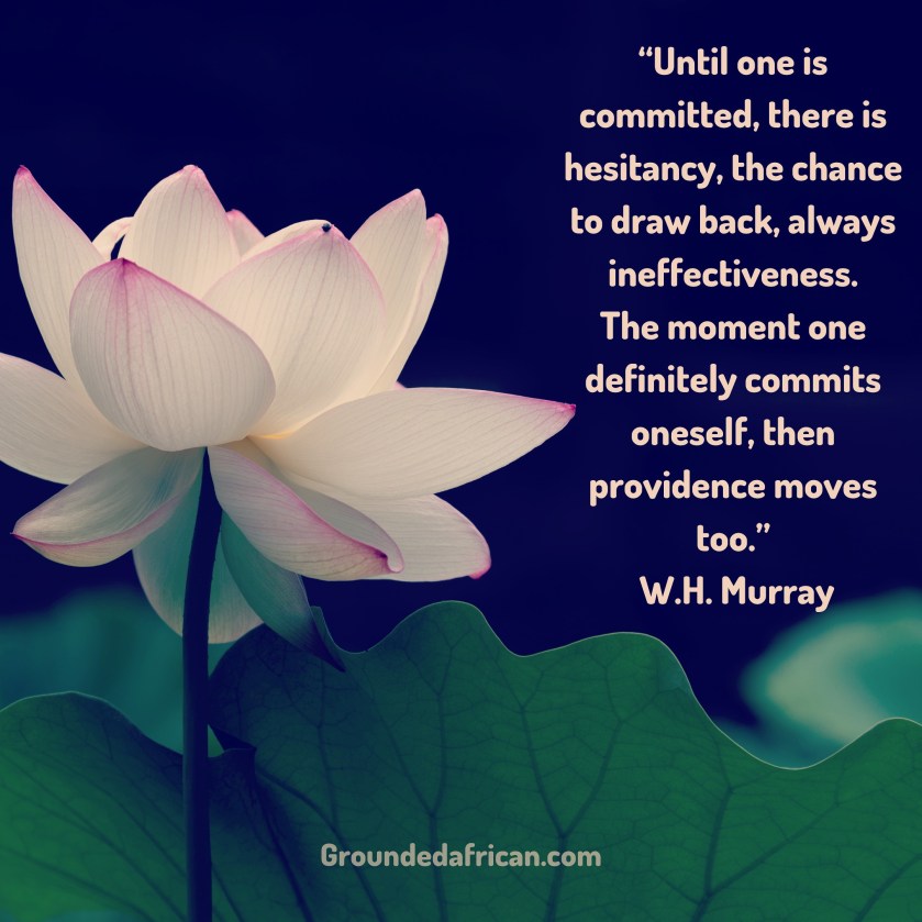 White flower with tinge of pink. Quote by W.H. Murray