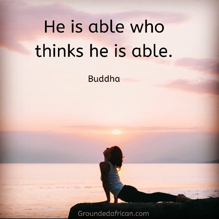 Women doing yoga on a rock