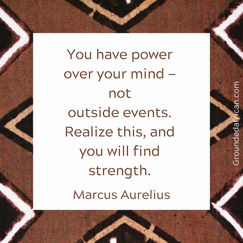 Text in box over a brown african print