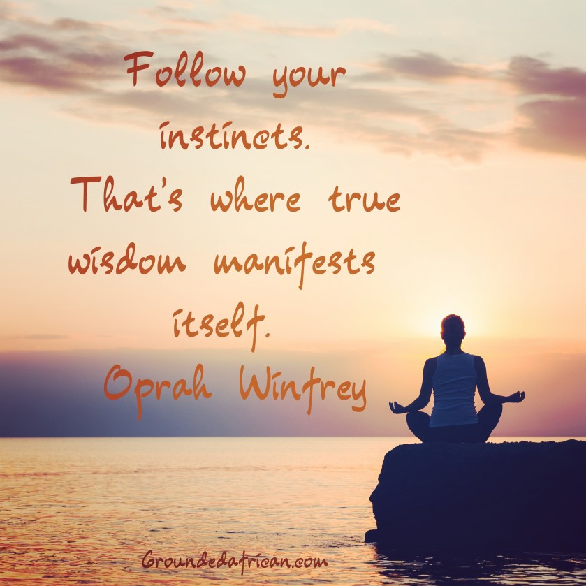 Lady meditating on the edge of a lake