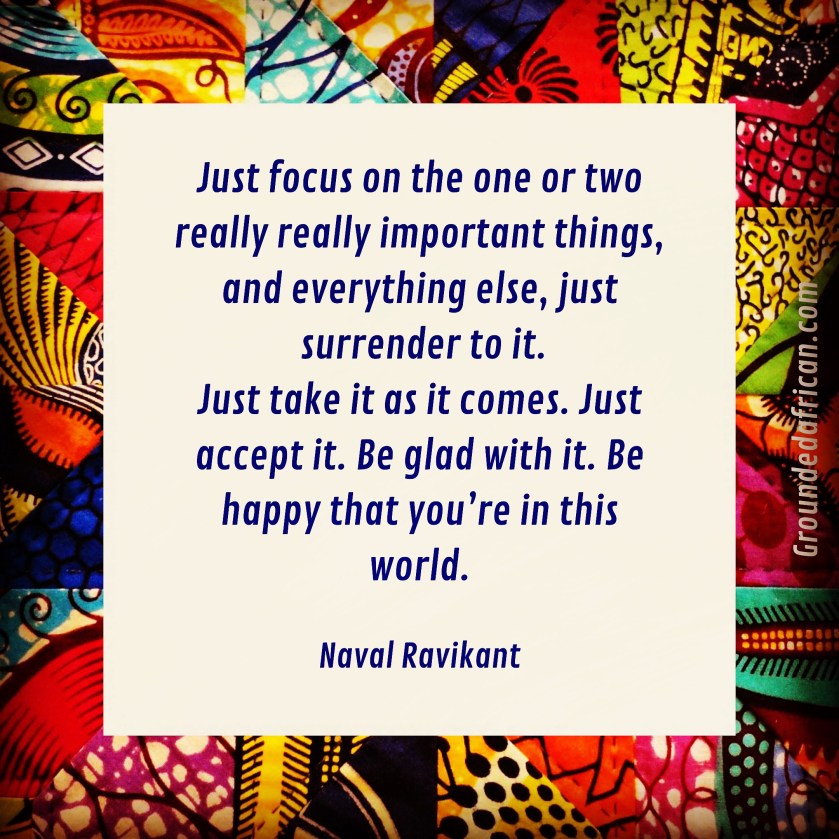Quote by Naval Ravikant on a white square over an African print