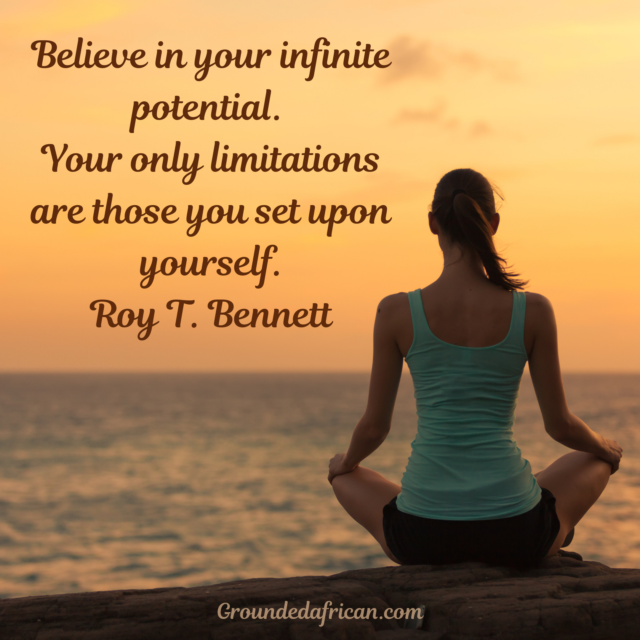 Woman meditating on rock facing the horizon at sunrise