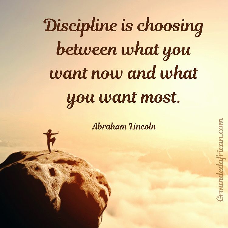 Man practicing Kata’s on top of mountain overlooking clouds