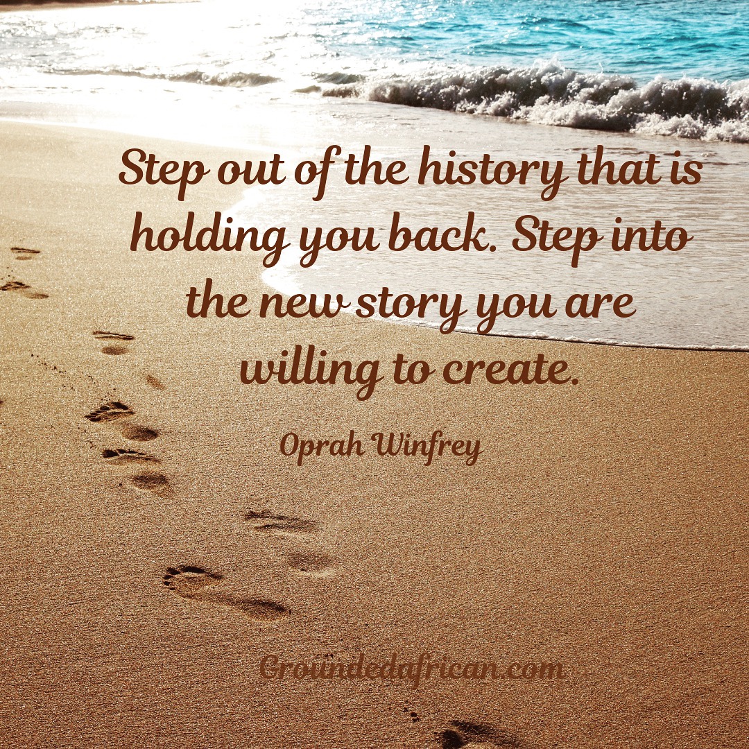 Footprints in sand near the water’s edge