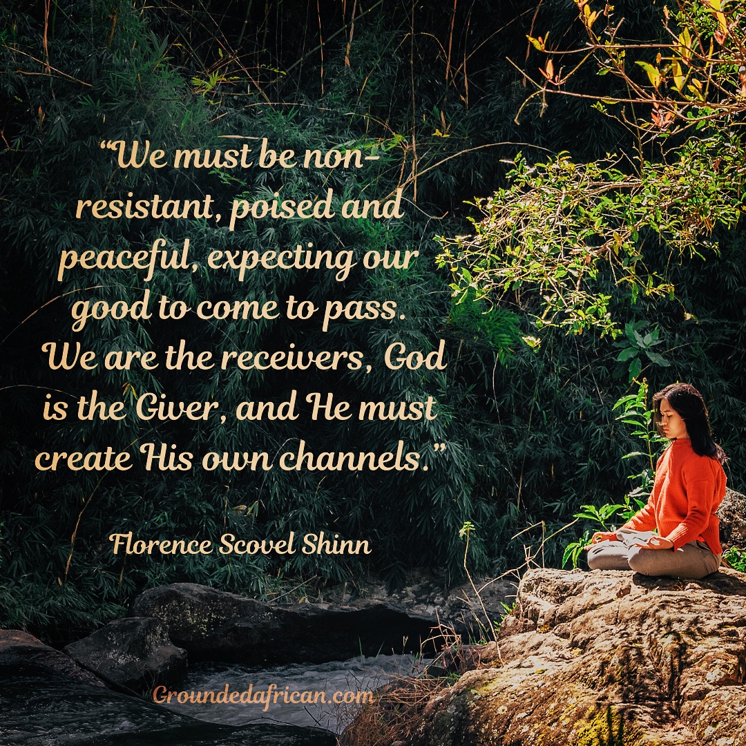 Lady meditating beside a stream 