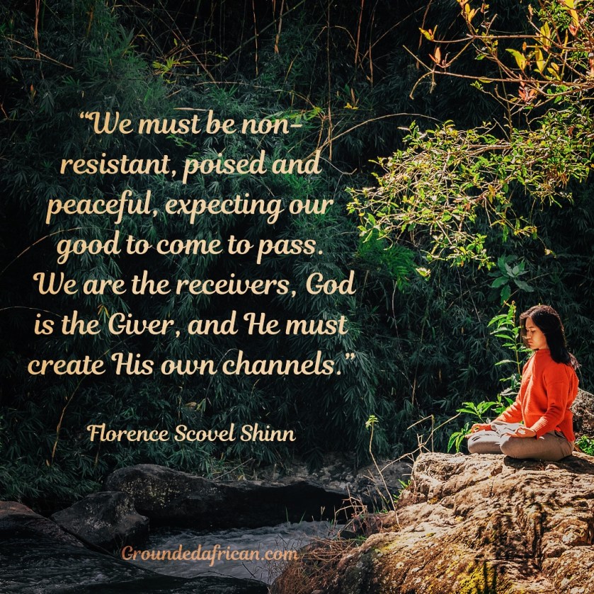 Lady meditating beside a stream