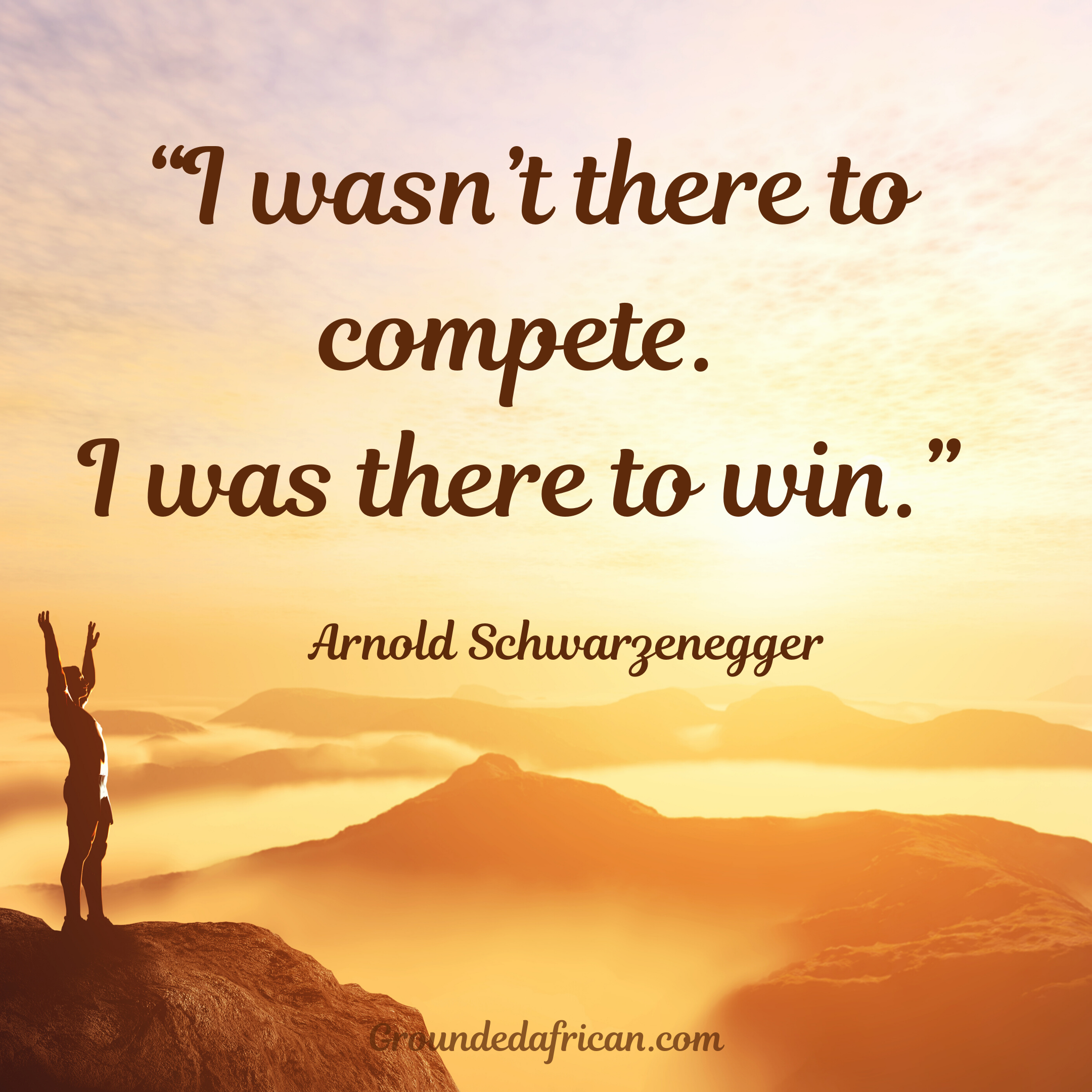 Person on top on mountain with arms raised in victory