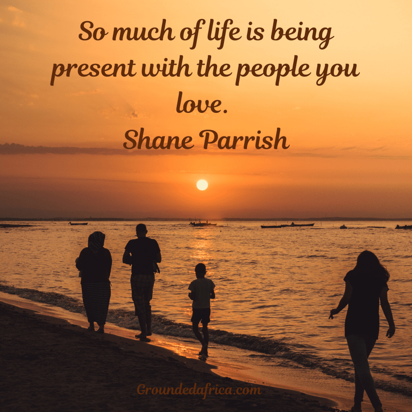 Family walking along water’s edge