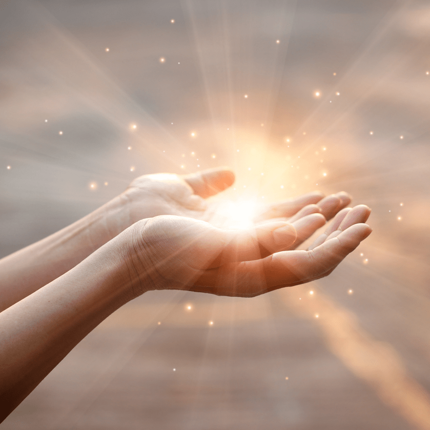 Hands with light in centre 