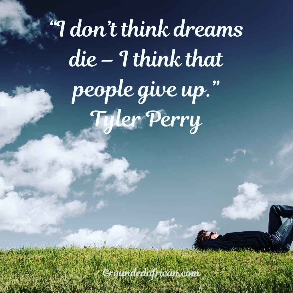 Person lying on glass looking at sky 